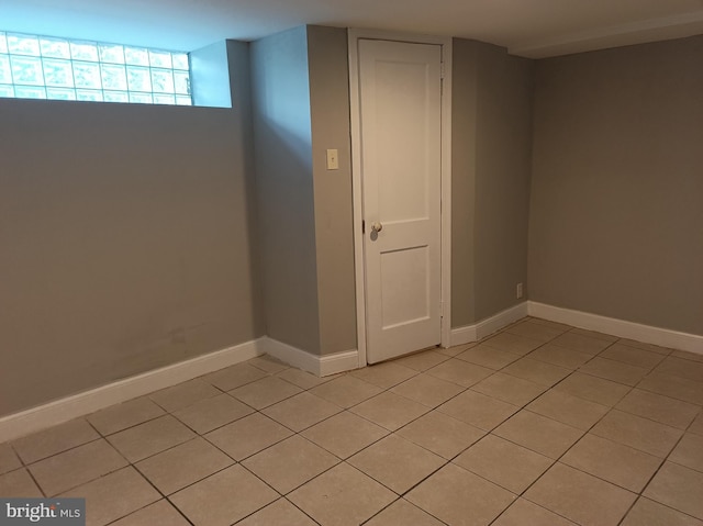 spare room with baseboards