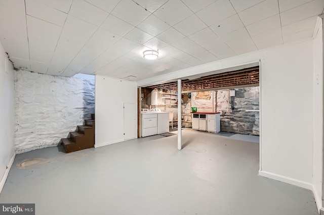 unfinished basement with washer and dryer and stairs