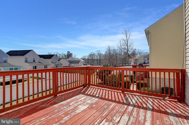 wooden terrace with a residential view