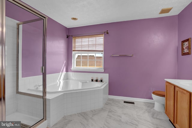 bathroom featuring a textured ceiling, visible vents, a stall shower, and vanity