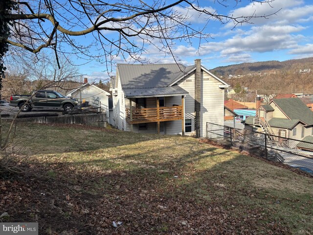 358-362 Stoney Batter, Bellefonte, PA 16823 - view of side of home featuring a lawn, metal roof, fence, and a mountain view