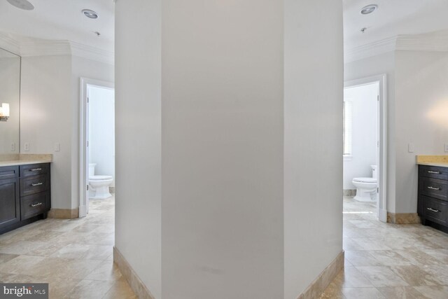 full bath with a bidet, ornamental molding, toilet, and vanity