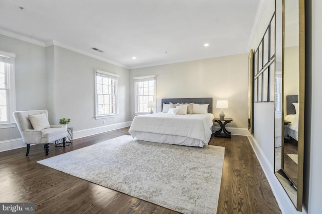 bedroom featuring crown molding, recessed lighting, baseboards, dark wood-style floors, and visible vents