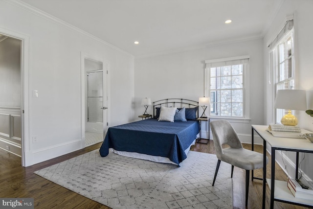 bedroom with baseboards, wood finished floors, and crown molding