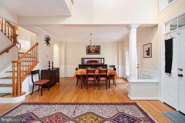 16647 Space More Cir, Woodbridge, VA 22191 - dining room with wood finished floors, stairway, crown molding, arched walkways, and a wainscoted wall