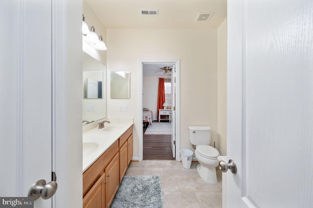 16647 Space More Cir, Woodbridge, VA 22191 - full bath featuring ensuite bath, double vanity, toilet, tile patterned flooring, and a ceiling fan