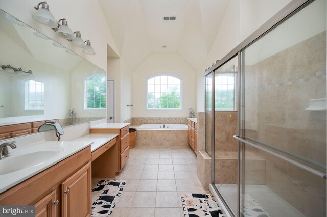 16647 Space More Cir, Woodbridge, VA 22191 - full bathroom with tile patterned floors, a stall shower, a bath, lofted ceiling, and vanity
