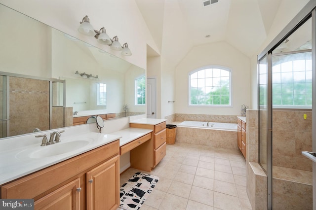 16647 Space More Cir, Woodbridge, VA 22191 - bathroom featuring plenty of natural light, tile patterned floors, lofted ceiling, a bath, and a shower stall