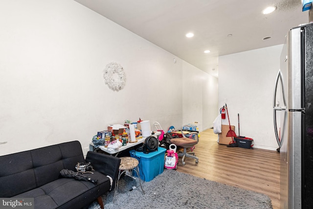 playroom featuring wood finished floors and recessed lighting