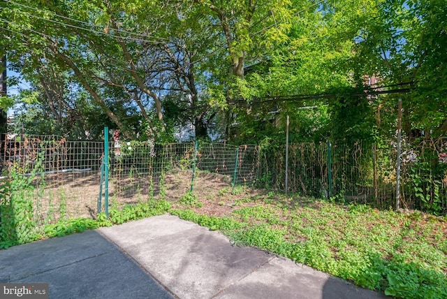 view of yard featuring a patio and fence