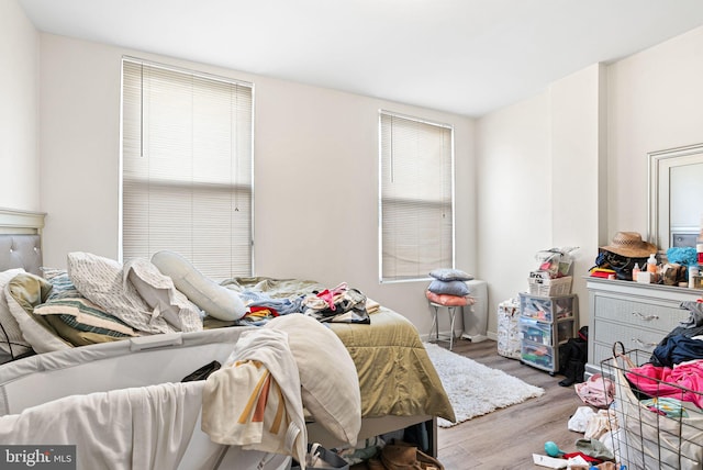bedroom featuring wood finished floors