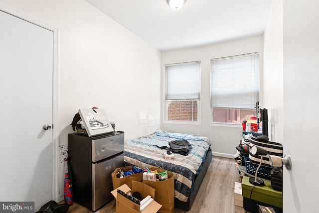 bedroom featuring wood finished floors