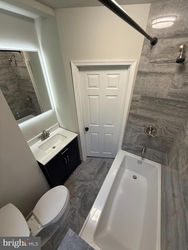 bathroom with toilet, a shower, a bathtub, and vanity