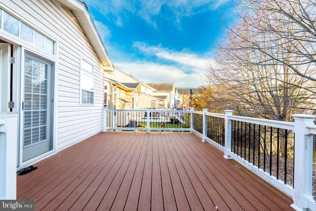 wooden terrace with a residential view