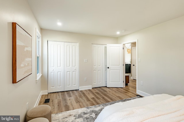 1198 Glenside Rd, Downingtown, PA 19335 - bedroom featuring baseboards, recessed lighting, visible vents, multiple closets, and wood finished floors