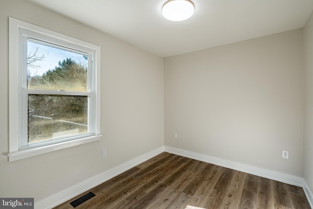 1198 Glenside Rd, Downingtown, PA 19335 - empty room with visible vents, baseboards, and dark wood finished floors