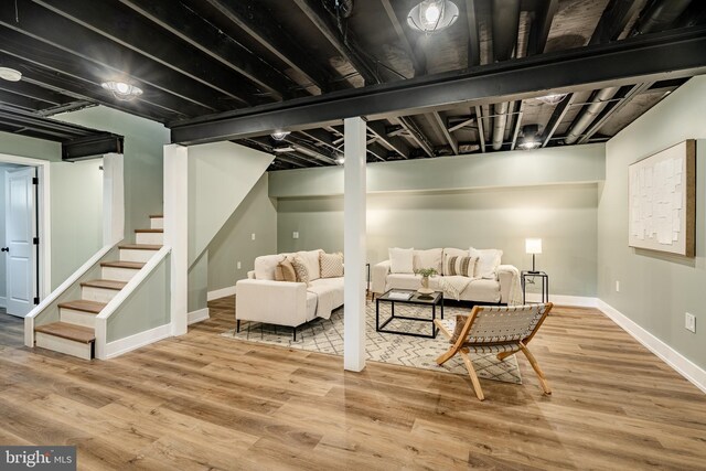 1198 Glenside Rd, Downingtown, PA 19335 - living room featuring baseboards, stairway, and wood finished floors