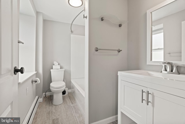 bathroom featuring shower / tub combination, vanity, toilet, wood finished floors, and a baseboard heating unit