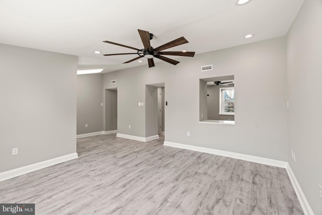 unfurnished room with ceiling fan, recessed lighting, baseboards, wood finished floors, and visible vents