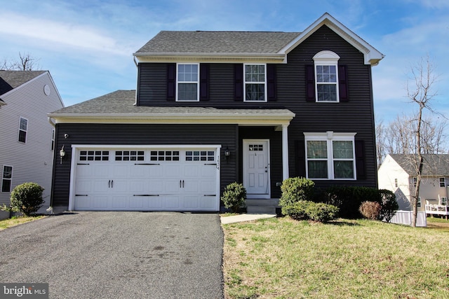 1634 Cape May Rd, Essex, MD 21221 - view of front facade with aphalt driveway, roof with shingles, and a front lawn