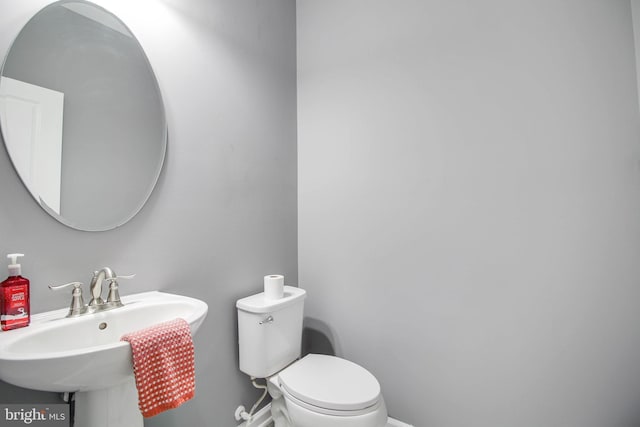 1634 Cape May Rd, Essex, MD 21221 - half bathroom with a sink, baseboards, and toilet