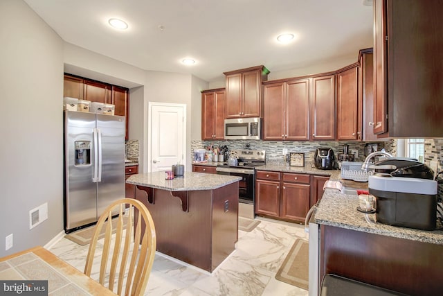 1634 Cape May Rd, Essex, MD 21221 - kitchen featuring light stone countertops, a kitchen island, marble finish floor, appliances with stainless steel finishes, and tasteful backsplash