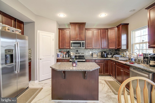 1634 Cape May Rd, Essex, MD 21221 - kitchen with marble finish floor, a sink, light stone counters, appliances with stainless steel finishes, and decorative backsplash