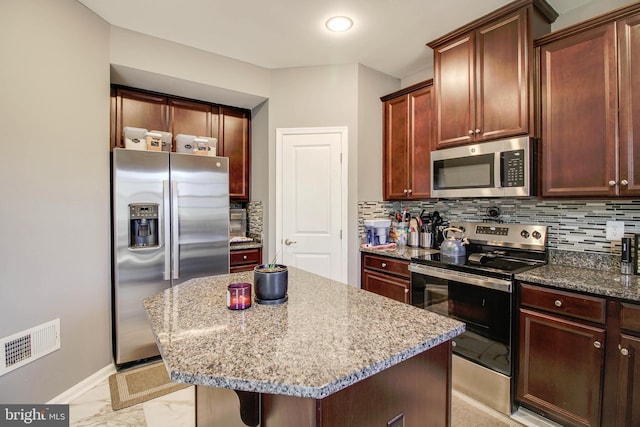 1634 Cape May Rd, Essex, MD 21221 - kitchen with tasteful backsplash, marble finish floor, visible vents, and appliances with stainless steel finishes
