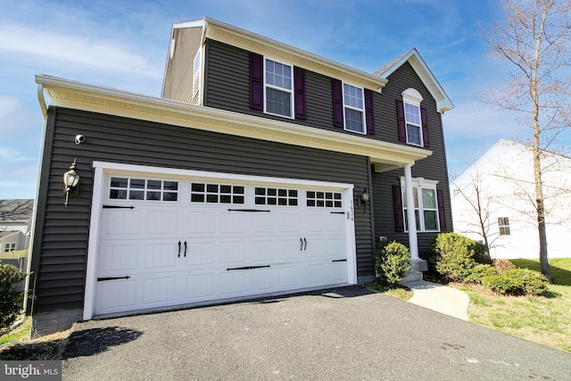 1634 Cape May Rd, Essex, MD 21221 - view of front facade with aphalt driveway and an attached garage