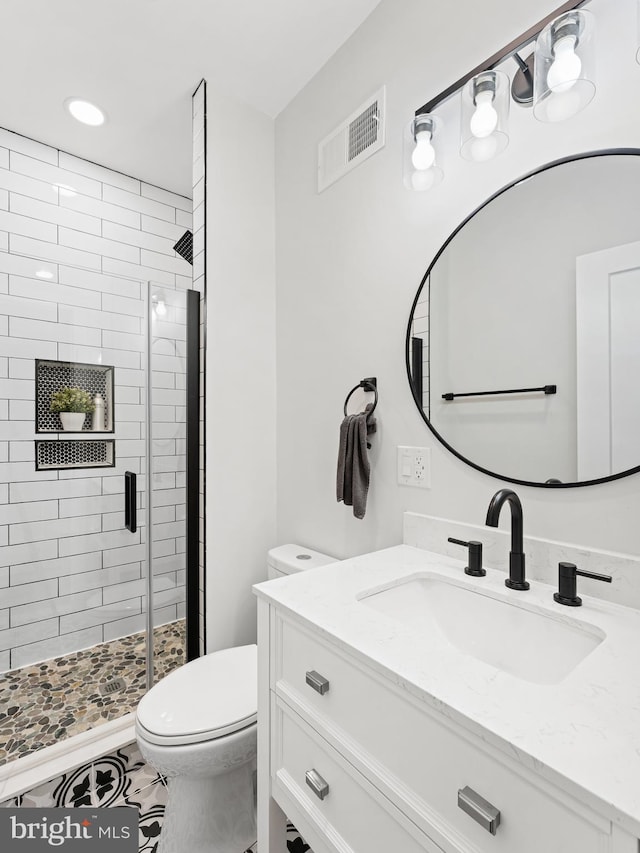 1611 N Dover St, Philadelphia, PA 19121 - full bath featuring vanity, a shower stall, toilet, and visible vents