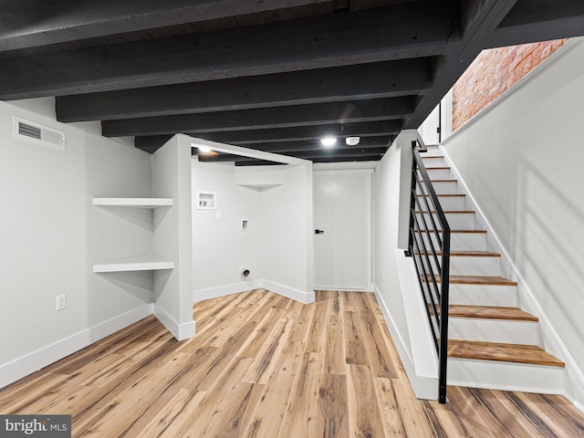 1611 N Dover St, Philadelphia, PA 19121 - finished below grade area with visible vents, baseboards, light wood-style floors, and stairs