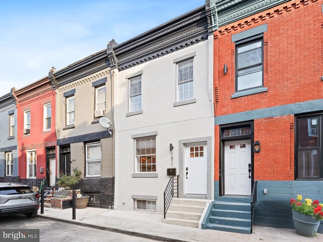 1611 N Dover St, Philadelphia, PA 19121 - view of front facade featuring stucco siding and entry steps