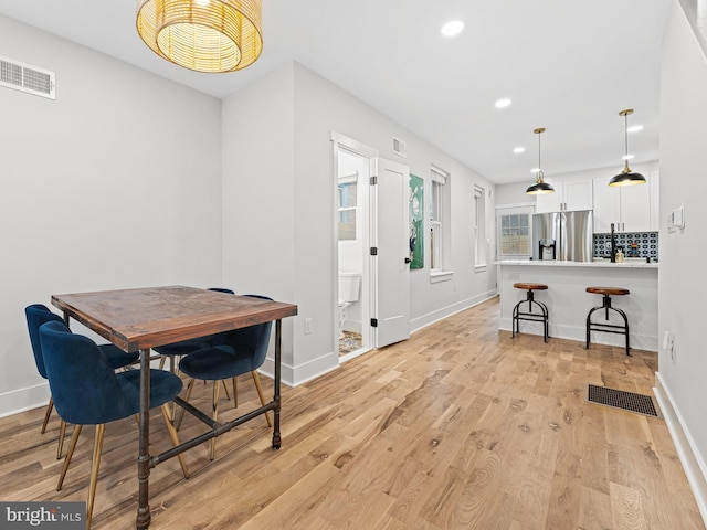 1611 N Dover St, Philadelphia, PA 19121 - dining room featuring recessed lighting, visible vents, and light wood-style floors