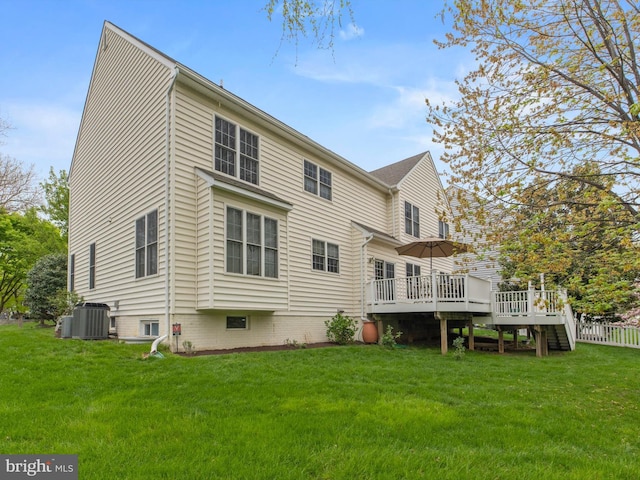 rear view of house with cooling unit, a deck, a lawn, and stairs