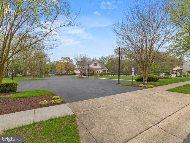 view of concrete road with sidewalks
