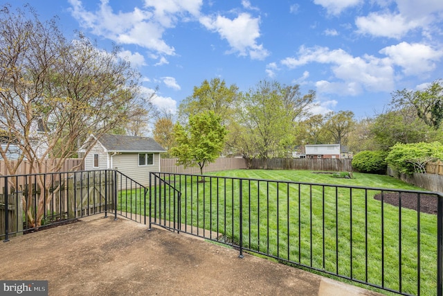 view of patio / terrace featuring an outdoor structure and a fenced backyard