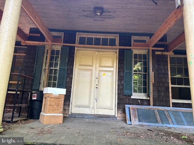 605 Upland Rd, Pikesville, MD 21208 - view of exterior entry with covered porch