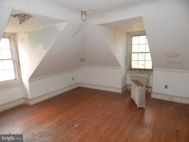 605 Upland Rd, Pikesville, MD 21208 - additional living space with radiator, baseboards, and hardwood / wood-style flooring