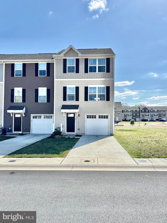 17692 Fieldstone Ave, Milford, DE 19963 - view of property with a front yard, board and batten siding, concrete driveway, and an attached garage