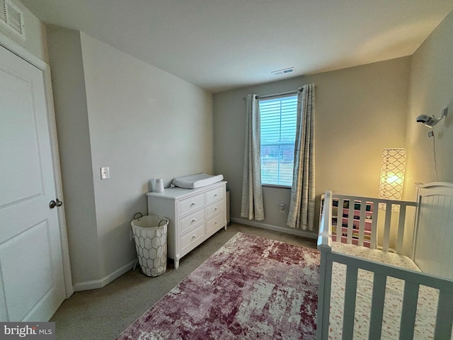 17692 Fieldstone Ave, Milford, DE 19963 - carpeted bedroom featuring baseboards, visible vents, and a nursery area