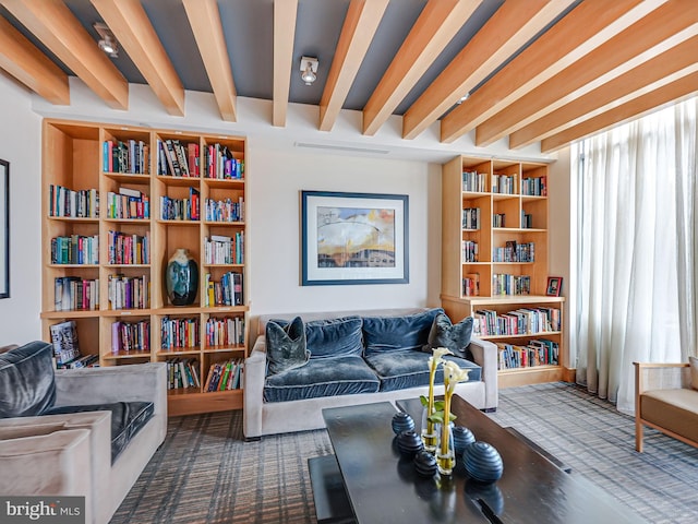 440 L St NW Unit 513, Washington, DC 20001 - sitting room featuring wall of books, carpet flooring, and beamed ceiling