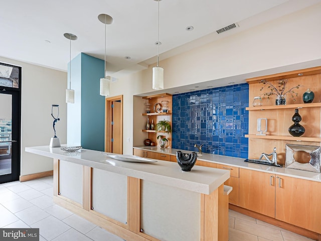 440 L St NW Unit 513, Washington, DC 20001 - kitchen with open shelves, tasteful backsplash, visible vents, and light tile patterned flooring