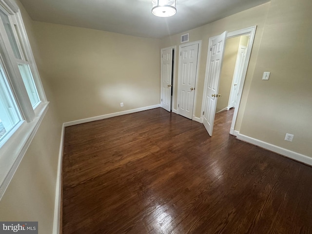 1636 Fort Davis Pl SE, Washington, DC 20020 - empty room featuring dark wood-style flooring and baseboards