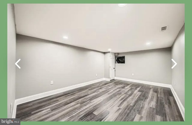 finished basement with recessed lighting, visible vents, baseboards, and wood finished floors
