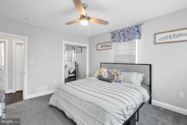 bedroom featuring visible vents, a ceiling fan, a closet, carpet floors, and baseboards