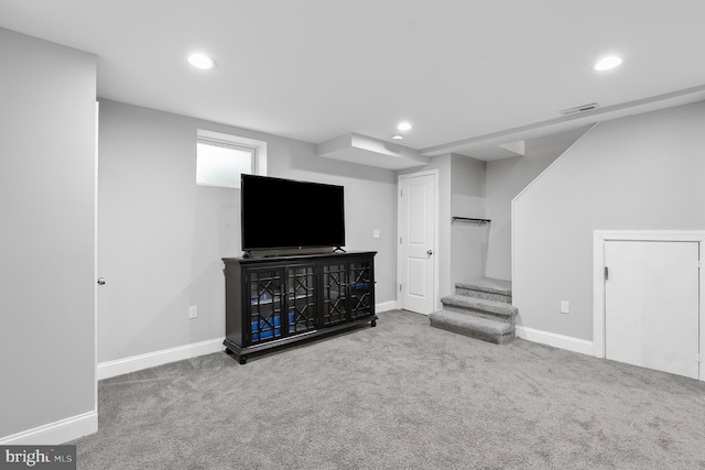 below grade area with visible vents, recessed lighting, carpet flooring, baseboards, and stairs