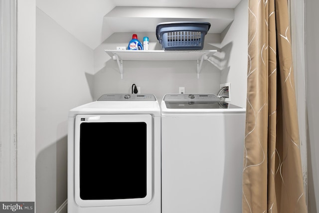 washroom featuring laundry area and washer and clothes dryer