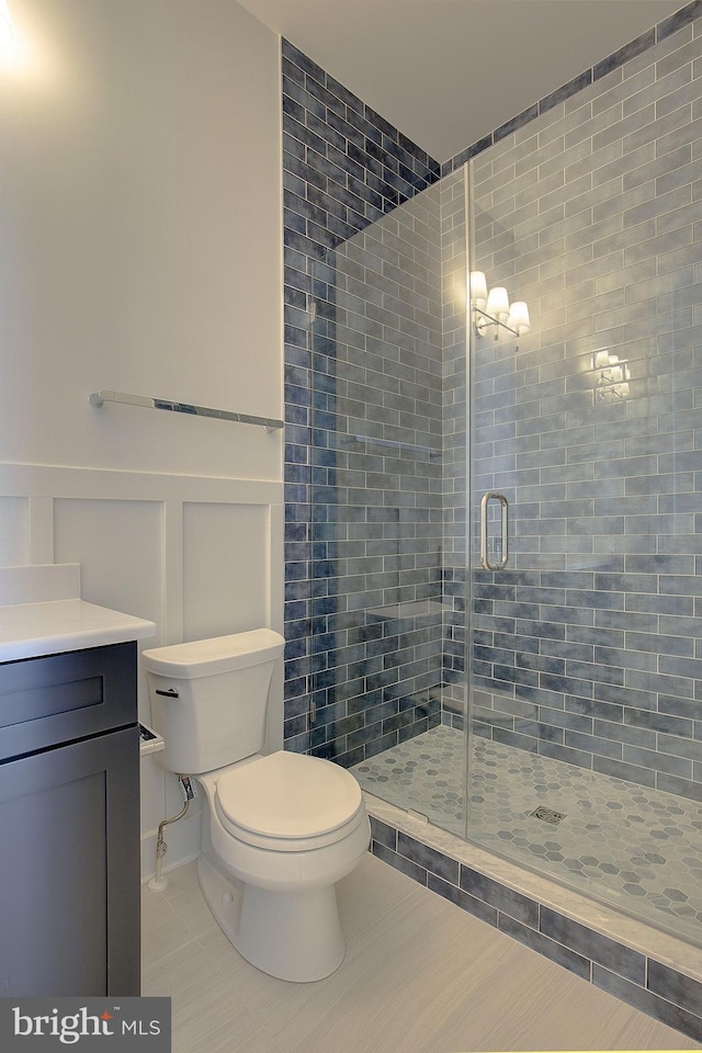 2762A Bon Haven Ln, Annapolis, MD 21401 - bathroom featuring a shower stall, vanity, tile patterned flooring, and toilet