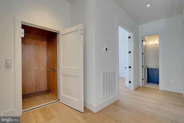 2762A Bon Haven Ln, Annapolis, MD 21401 - hallway with elevator, visible vents, light wood-type flooring, and baseboards