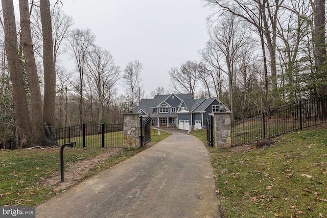 2762A Bon Haven Ln, Annapolis, MD 21401 - view of front of property with a front yard, stone siding, fence, a gate, and driveway